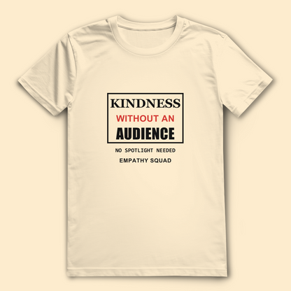 Mockup, Vorderansicht: cremefarbenes T-Shirt mit „Kindness Without an Audience“ in Schwarz und Rot und „No Spotlight Needed“.